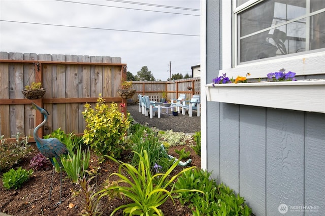 exterior view of fence and a fire pit