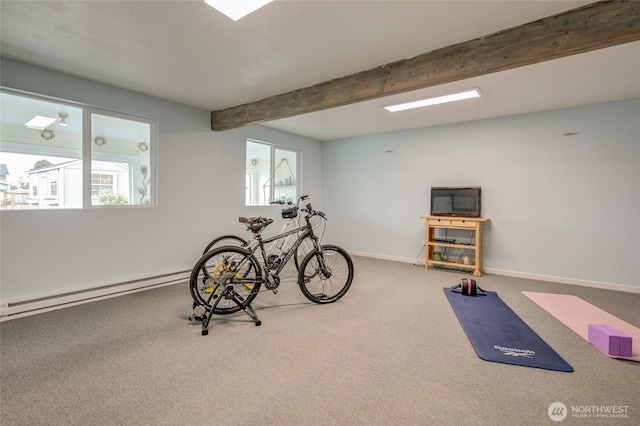 exercise area with carpet, a baseboard heating unit, and baseboards