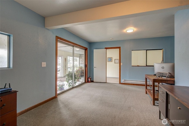 office area featuring light carpet, baseboard heating, and baseboards