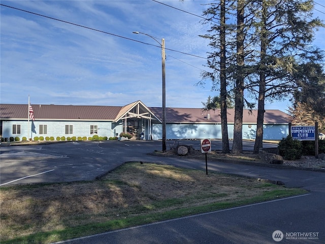 view of property featuring uncovered parking
