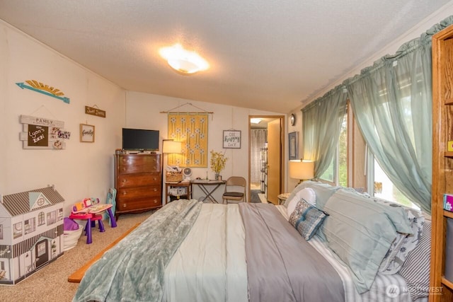 carpeted bedroom with vaulted ceiling