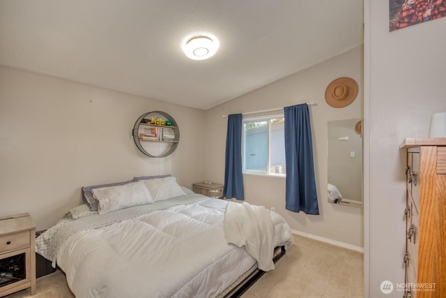 bedroom featuring vaulted ceiling, carpet, and baseboards
