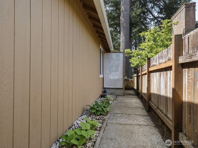 view of side of property with fence