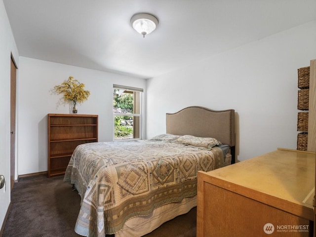 bedroom with dark carpet