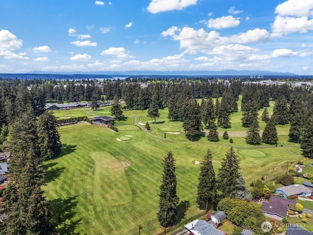 bird's eye view of a golf club and a large body of water