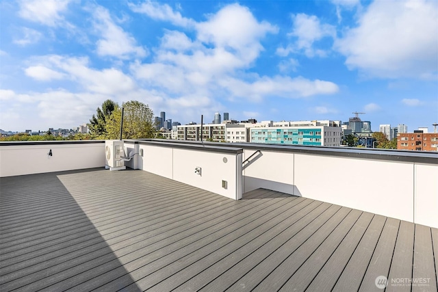 wooden deck with a city view