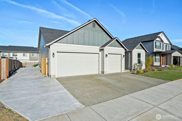18009 NE 46th Ct, Vancouver, WA 98686 - view of front facade featuring board and batten siding, driveway, a garage, and a residential view