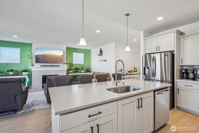 18009 NE 46th Ct, Vancouver, WA 98686 - kitchen with a sink, open floor plan, dishwasher, light countertops, and recessed lighting