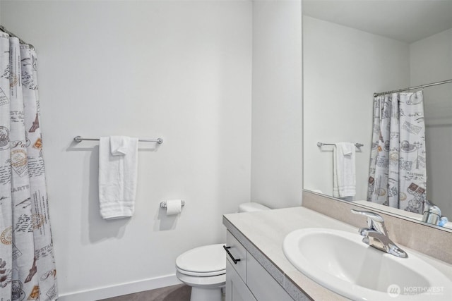 18009 NE 46th Ct, Vancouver, WA 98686 - bathroom with toilet, vanity, baseboards, and curtained shower