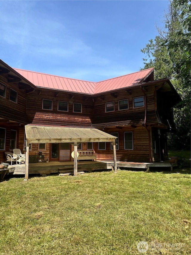 5790 NE Old Mill Rd NE, Bainbridge Island, WA 98110 - rear view of property with a yard, a deck, and metal roof