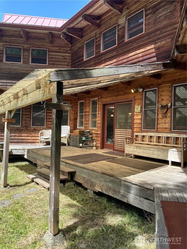 5790 NE Old Mill Rd NE, Bainbridge Island, WA 98110 - back of house with a wooden deck and metal roof