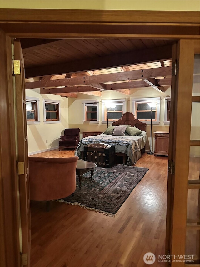 5790 NE Old Mill Rd NE, Bainbridge Island, WA 98110 - bedroom with beamed ceiling, wood finished floors, and wood ceiling