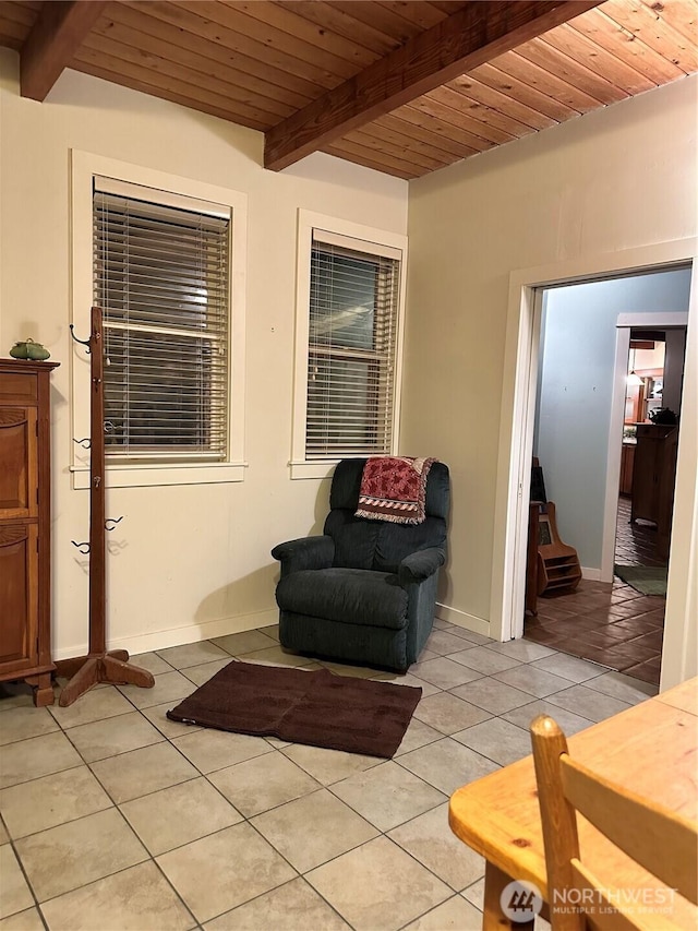 5790 NE Old Mill Rd NE, Bainbridge Island, WA 98110 - living area featuring light tile patterned floors, beam ceiling, wood ceiling, and baseboards