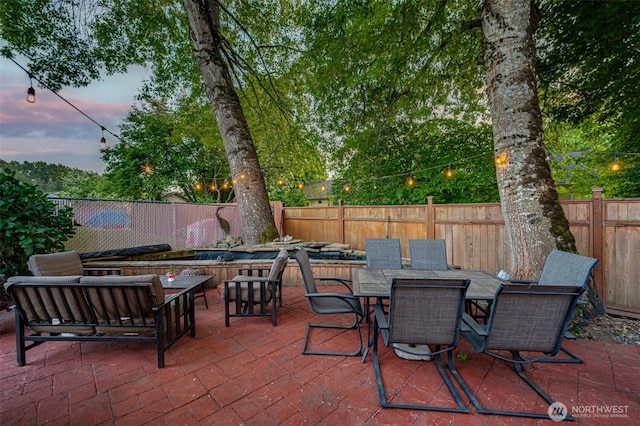 231 Valley Way, Woodland, WA 98674 - patio terrace at dusk featuring a fenced backyard and outdoor dining area