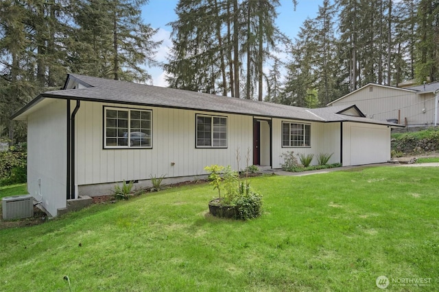ranch-style home featuring a front lawn, central AC, and a shingled roof