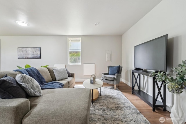 living area featuring wood finished floors and baseboards