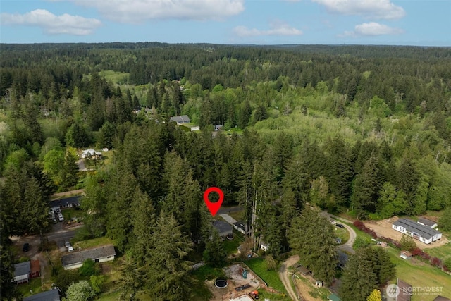 aerial overview of property's location with a forest