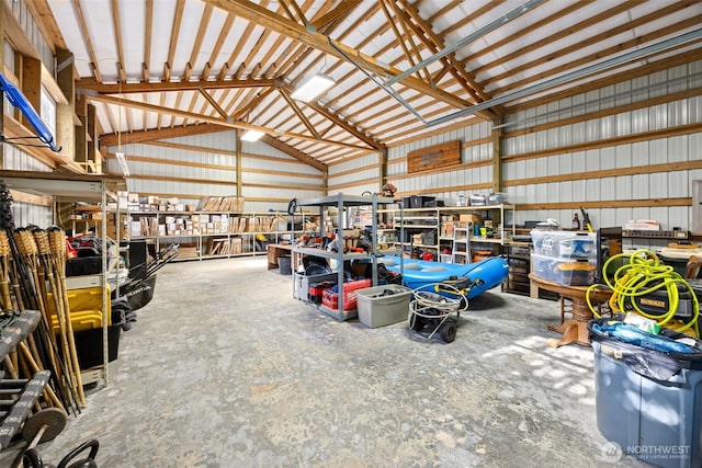 garage featuring a workshop area and metal wall