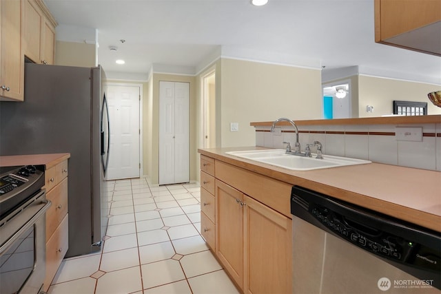 kitchen featuring stainless steel appliances, a sink, light brown cabinetry, recessed lighting, and light tile patterned floors