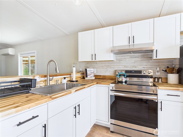 212 Old Owen Rd Unit 43, Sultan, WA 98294 - kitchen with electric range, under cabinet range hood, and butcher block counters