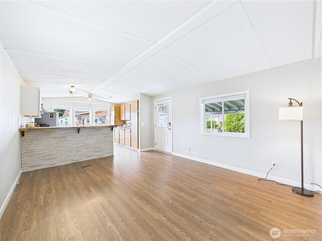 212 Old Owen Rd Unit 43, Sultan, WA 98294 - unfurnished living room with baseboards, light wood-style flooring, and a ceiling fan