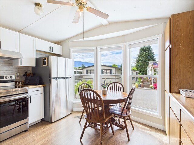 212 Old Owen Rd Unit 43, Sultan, WA 98294 - dining space with plenty of natural light, light wood finished floors, a ceiling fan, and baseboards