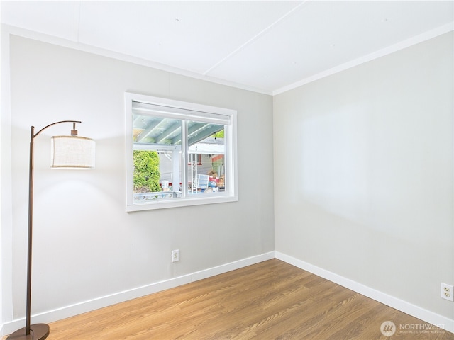 212 Old Owen Rd Unit 43, Sultan, WA 98294 - spare room with wood finished floors, baseboards, and crown molding