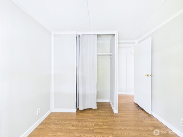 212 Old Owen Rd Unit 43, Sultan, WA 98294 - unfurnished bedroom with light wood finished floors, a closet, and baseboards