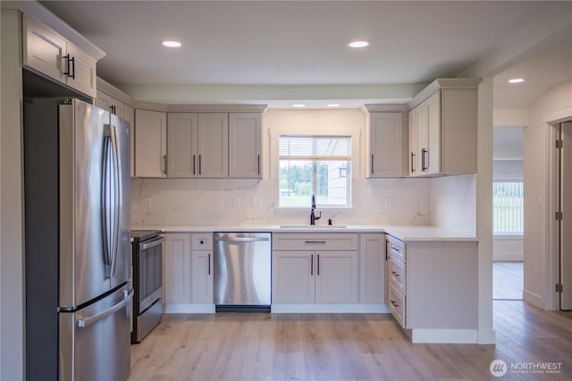 343 Hawkins Rd, Winlock, WA 98596 - kitchen with stainless steel appliances, a sink, plenty of natural light, light wood finished floors, and recessed lighting