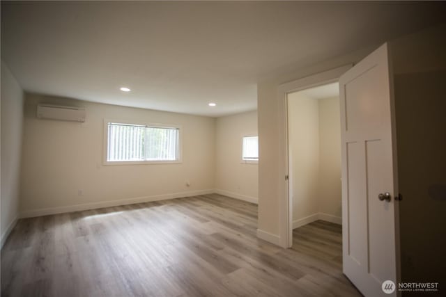 343 Hawkins Rd, Winlock, WA 98596 - unfurnished room with a wall mounted AC, wood finished floors, baseboards, and recessed lighting