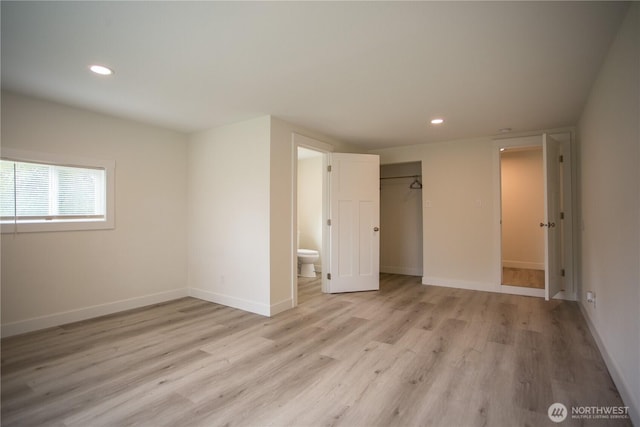 343 Hawkins Rd, Winlock, WA 98596 - unfurnished bedroom with light wood-style floors, recessed lighting, baseboards, a closet, and ensuite bath