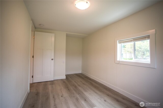 343 Hawkins Rd, Winlock, WA 98596 - unfurnished bedroom with baseboards and wood finished floors