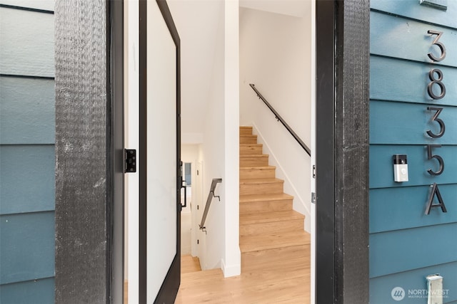 stairs with wood finished floors