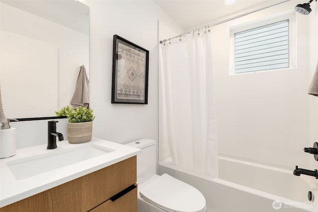 full bath with toilet, shower / bath combo, and vanity