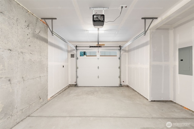 garage featuring electric panel and a garage door opener