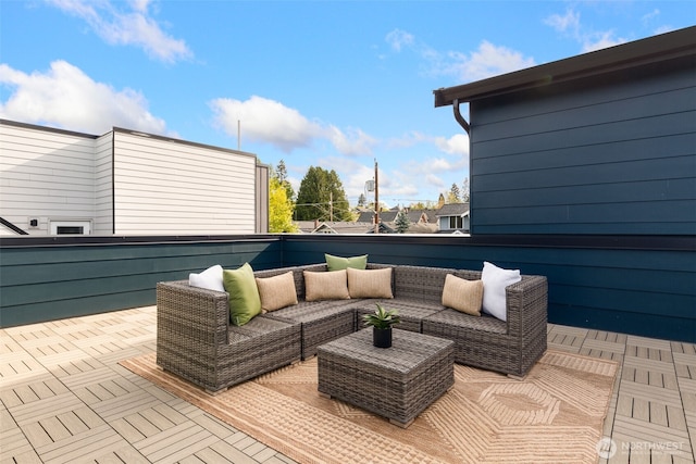 wooden terrace featuring an outdoor hangout area