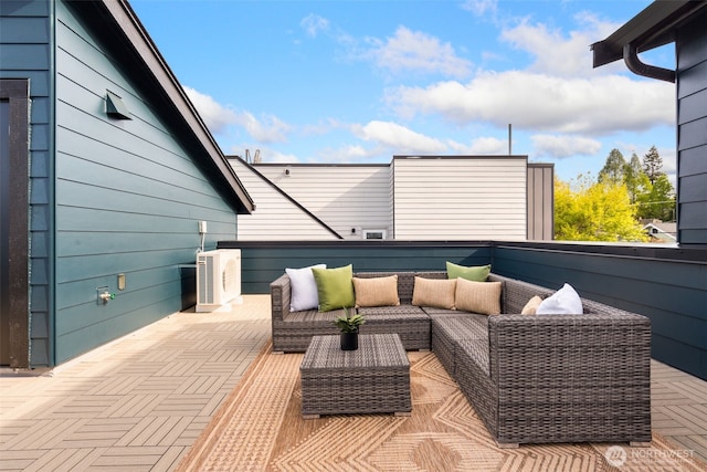 view of patio / terrace featuring a balcony, an outdoor hangout area, and a cooling unit