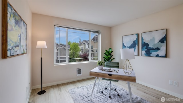 office space featuring wood finished floors and baseboards