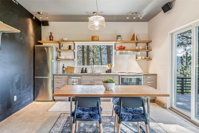 981 Nighthawk Ridge Ln, Leavenworth, WA 98826 - kitchen featuring freestanding refrigerator, open shelves, electric range, concrete floors, and rail lighting