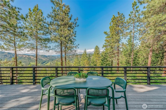 981 Nighthawk Ridge Ln, Leavenworth, WA 98826 - deck with outdoor dining area and a view of trees