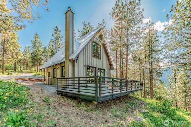 981 Nighthawk Ridge Ln, Leavenworth, WA 98826 - view of side of home featuring a wooden deck, a metal roof, and board and batten siding