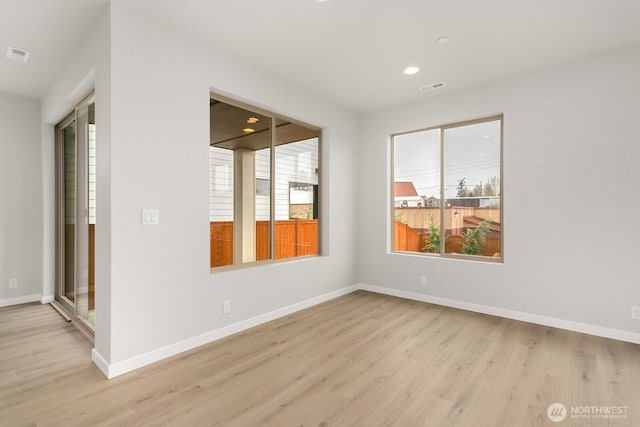 13302 SE 238th Pl Unit 7, Kent, WA 98042 - empty room with light wood-type flooring, baseboards, and recessed lighting