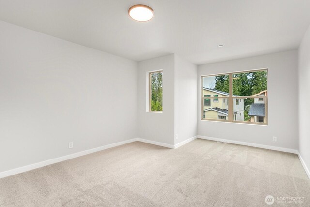 13302 SE 238th Pl Unit 7, Kent, WA 98042 - carpeted empty room with baseboards
