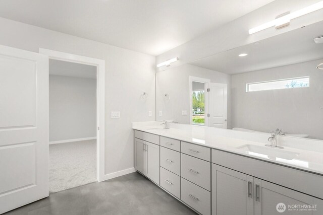 13302 SE 238th Pl Unit 7, Kent, WA 98042 - bathroom with double vanity, toilet, baseboards, concrete flooring, and recessed lighting