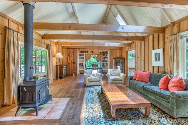 1472 White Beach Rd, Orcas Island, WA 98280 - living area with a wood stove, light wood finished floors, and wooden walls