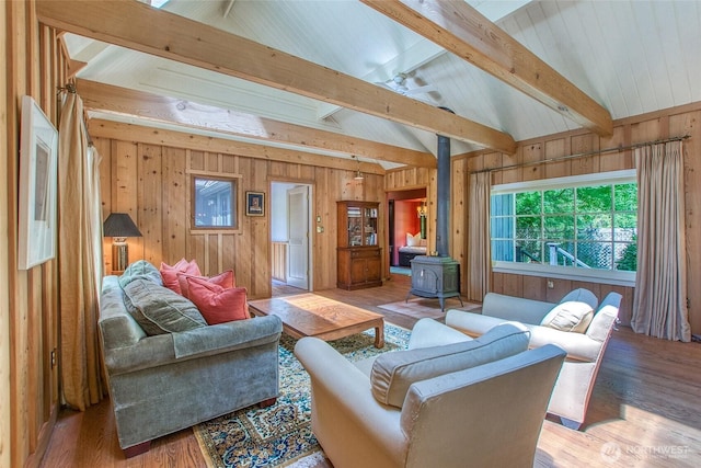1472 White Beach Rd, Orcas Island, WA 98280 - living area featuring a wood stove, wooden walls, and wood finished floors