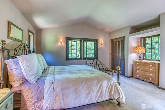 1472 White Beach Rd, Orcas Island, WA 98280 - bedroom with multiple windows, lofted ceiling, carpet floors, and a closet