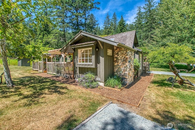 1472 White Beach Rd, Orcas Island, WA 98280 - view of property exterior with board and batten siding, an outbuilding, and stone siding