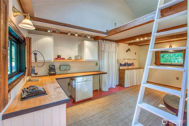 1472 White Beach Rd, Orcas Island, WA 98280 - kitchen featuring beamed ceiling, light wood-style floors, open shelves, and wood counters