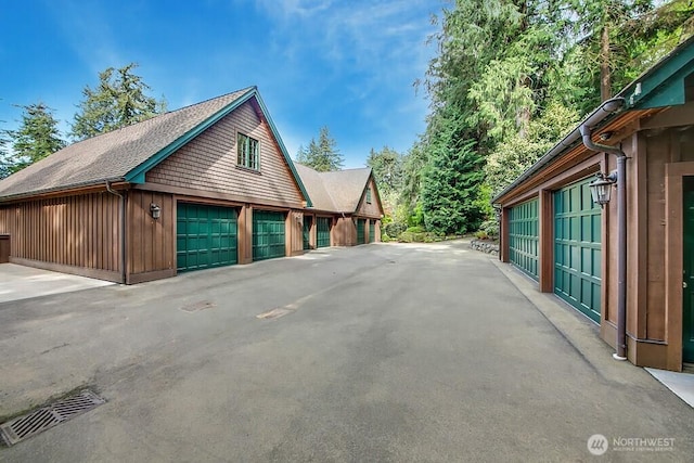 11211 Wachusett Rd, Woodway, WA 98020 - view of side of property with a garage